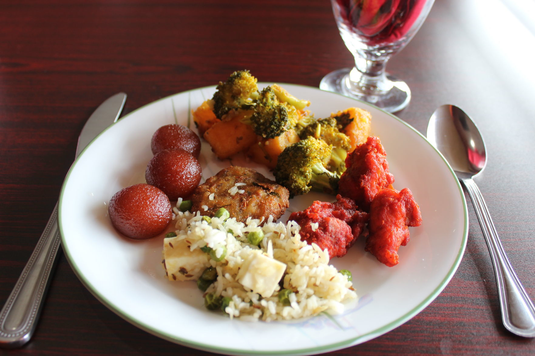Gulab jamun, peas pulao, fried chili chicken with onion and capsicum, broccoli and potato curry, aloo tikki (buffet dish) (1).JPG